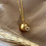 Estelle llamador de ángeles de oro